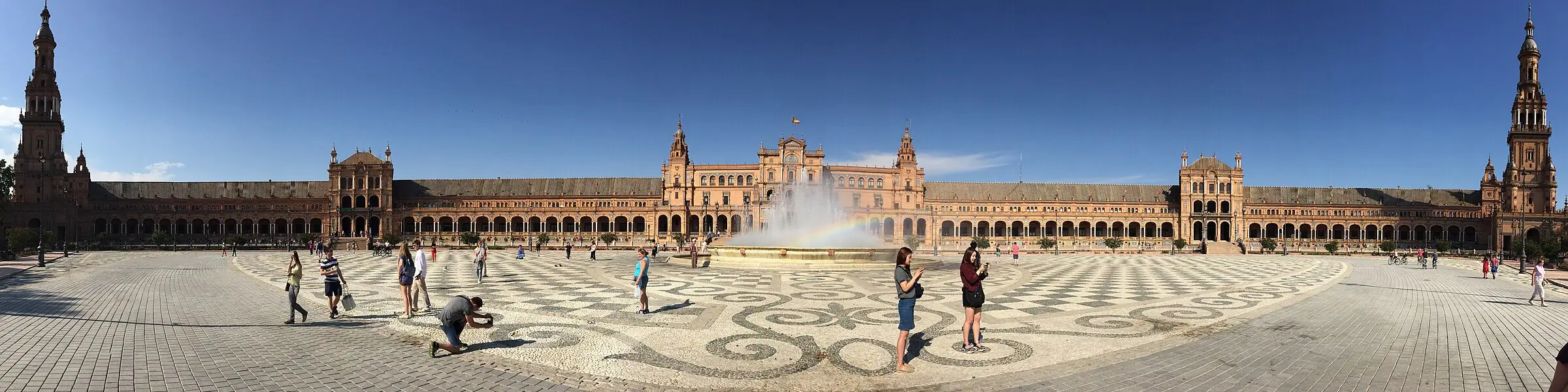 The curved colonnade and fountain of the Plaza de Espana in Seville
